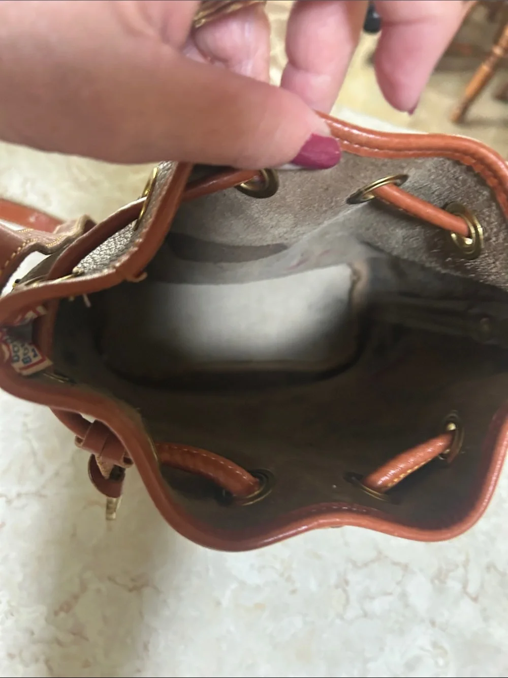 Dooney & Bourke Taupe Leather Crossbody Bucket Bag with Brown Trim